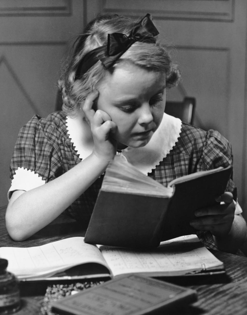 Young girl reading book