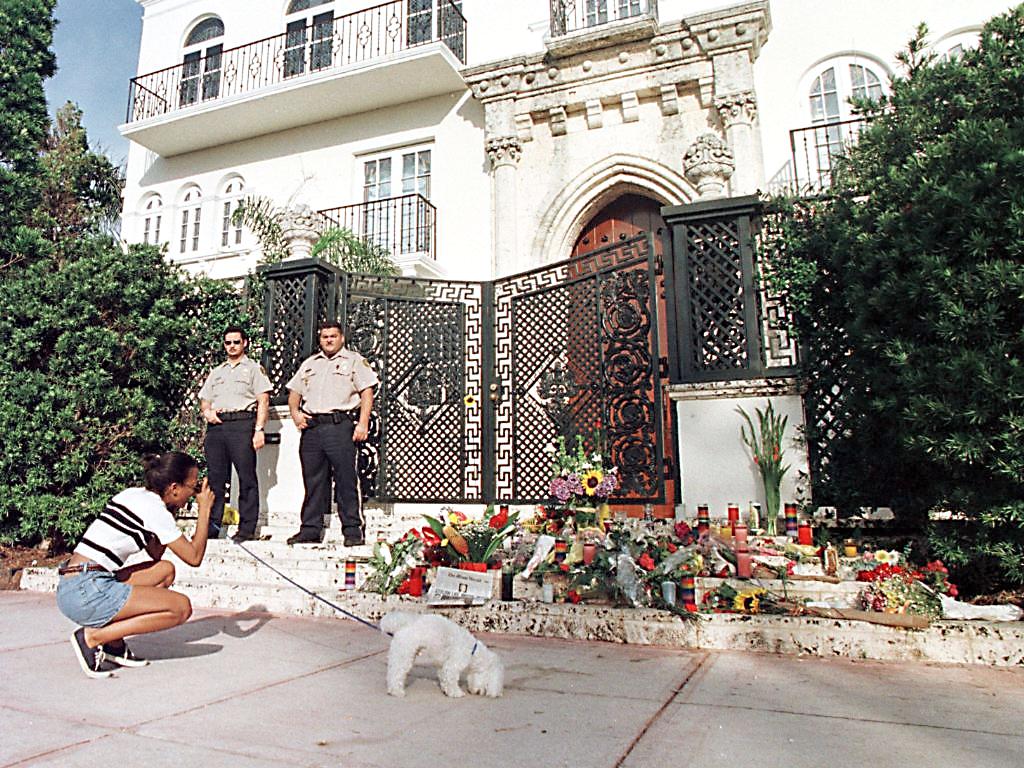 Private security guards stand in front of the hous