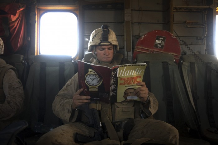 A US Marine reads a copy of Atlantic mag